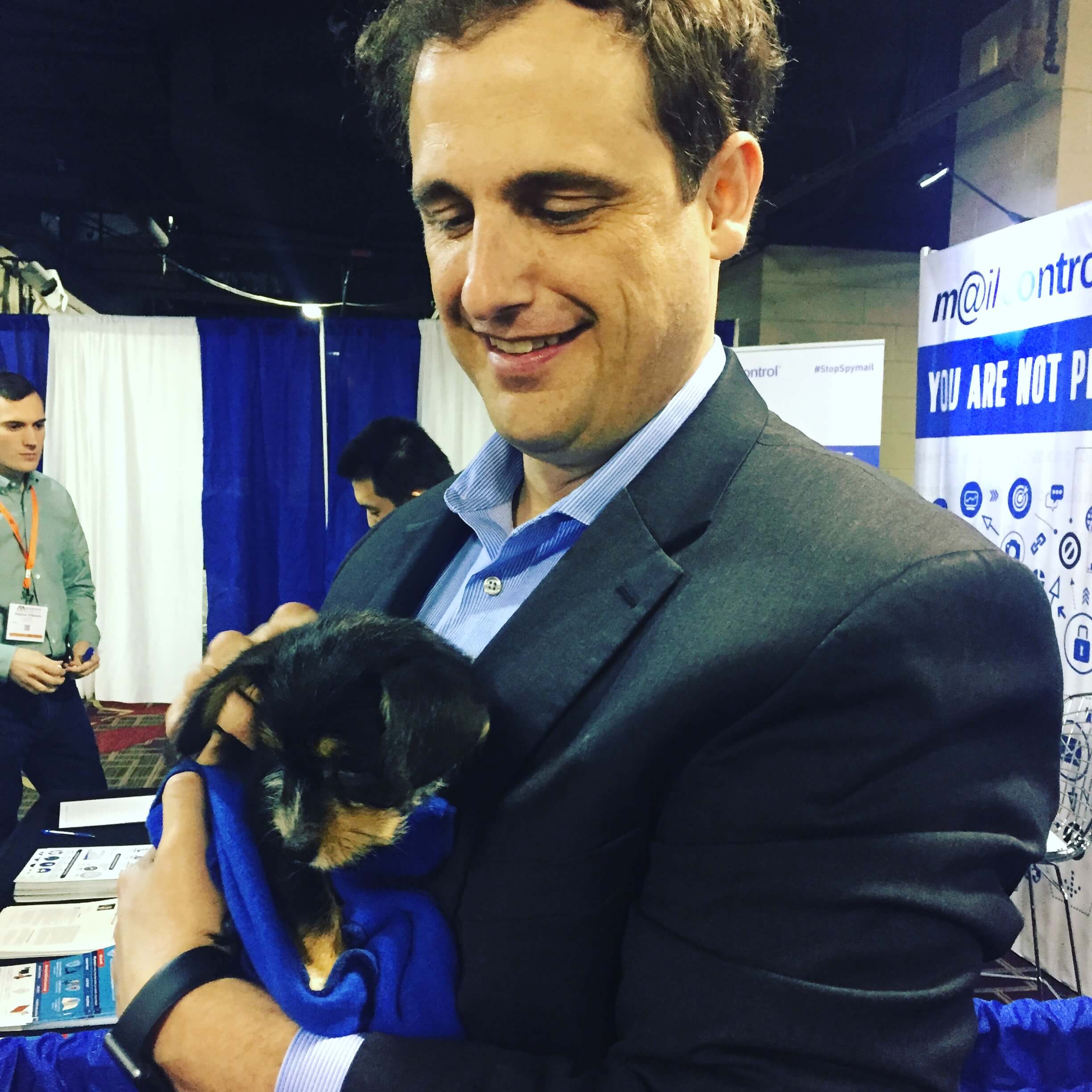 Laurence Colletti with a puppy.