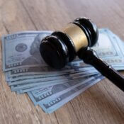 Gavel on top of a stack of $100 bills