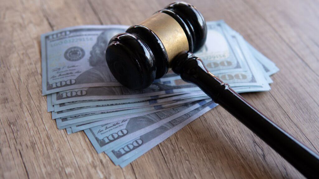 Gavel on top of a stack of $100 bills wide