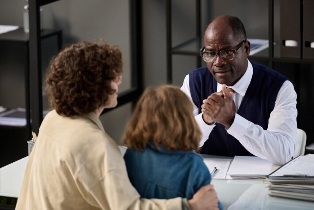 Mother and child talking to an immigration attorney