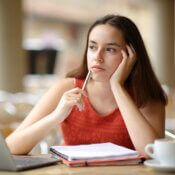 Woman pondering her studies