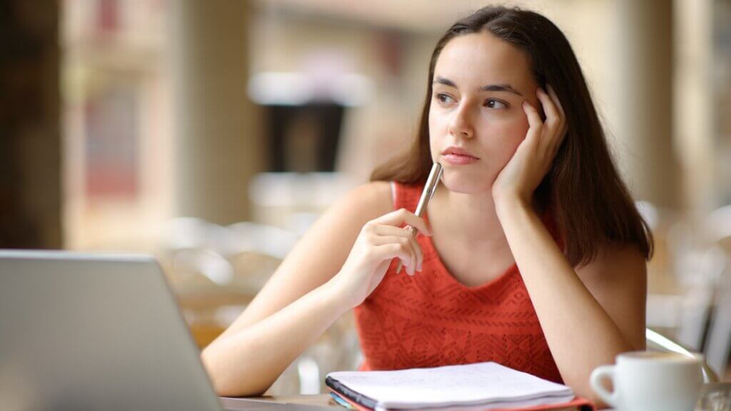 Woman pondering her studies