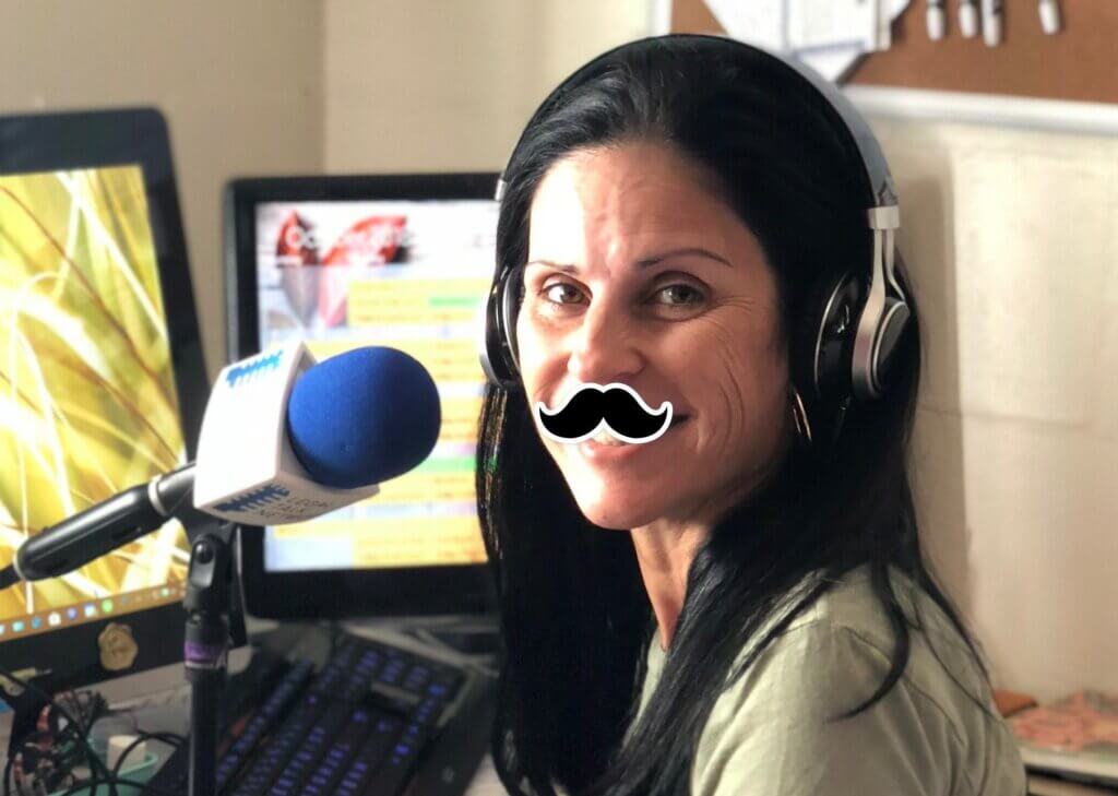 Adriana Linares Wearing Goofy Mustache While Recording Podcast