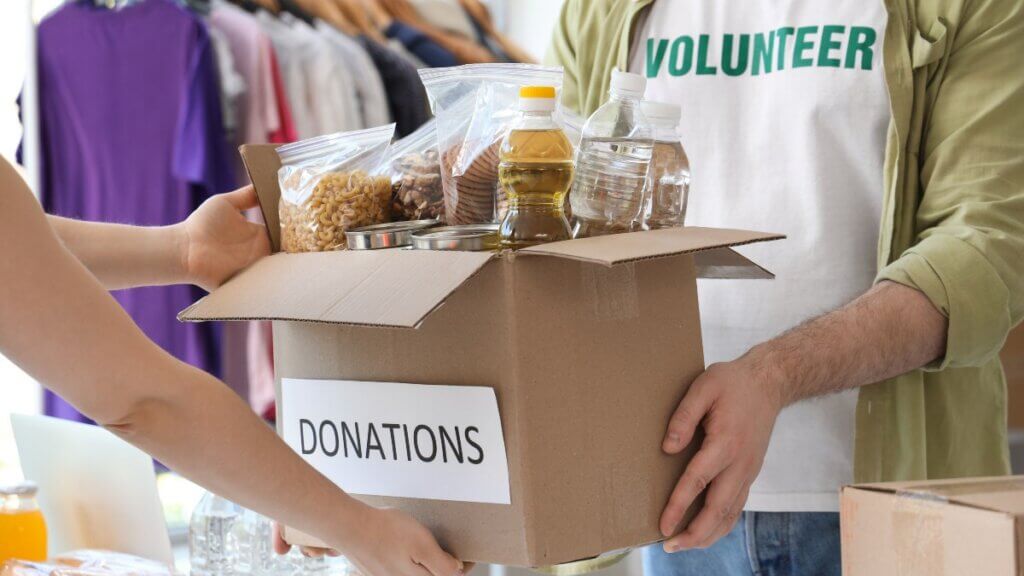 Volunteer giving donations