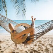 Woman sitting in a hammock on vacation